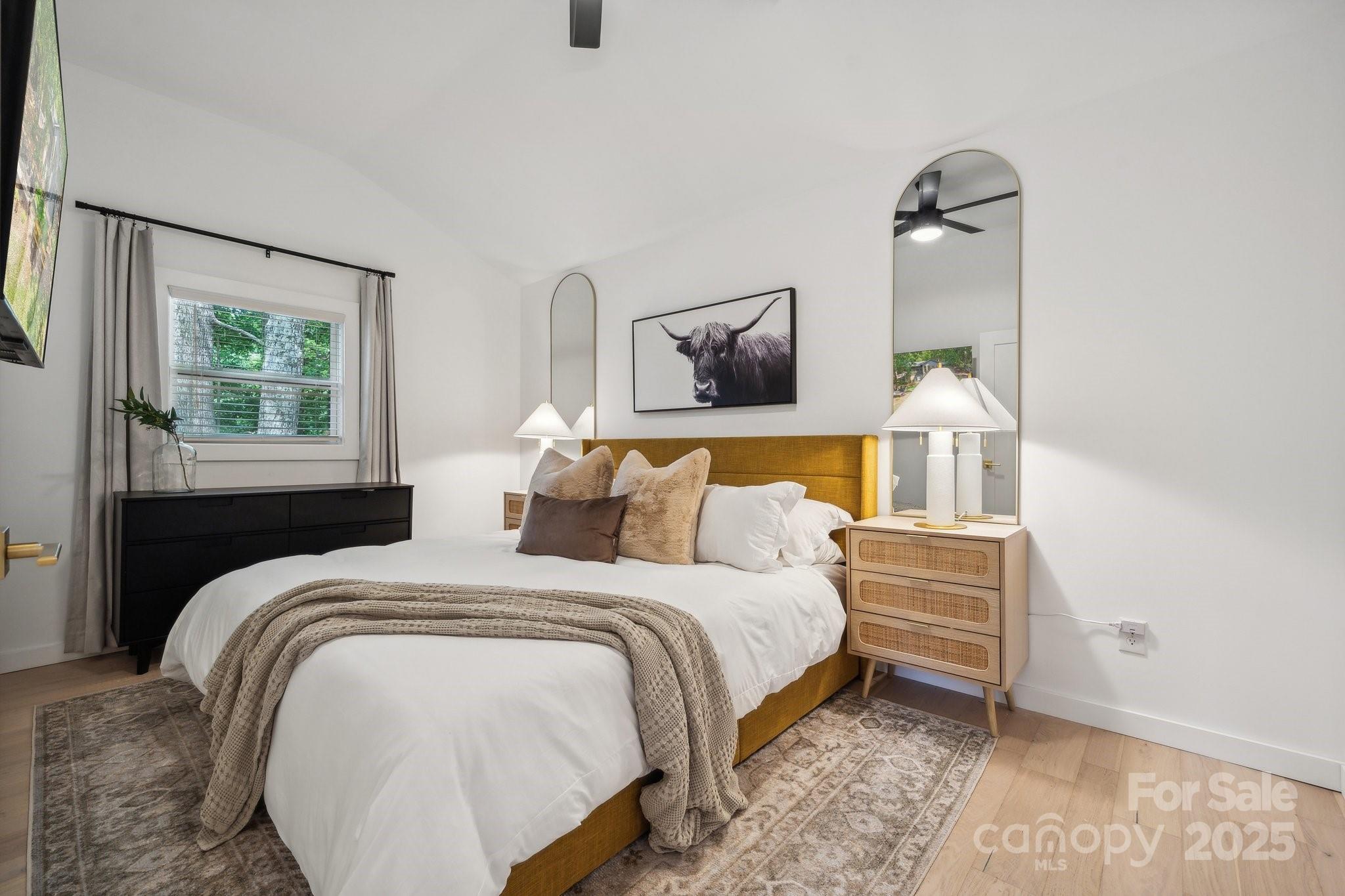 254 South Fork Road Mooresville, NC 28117 - Photo 8 of 34 a bedroom with a bed a mirror and a window