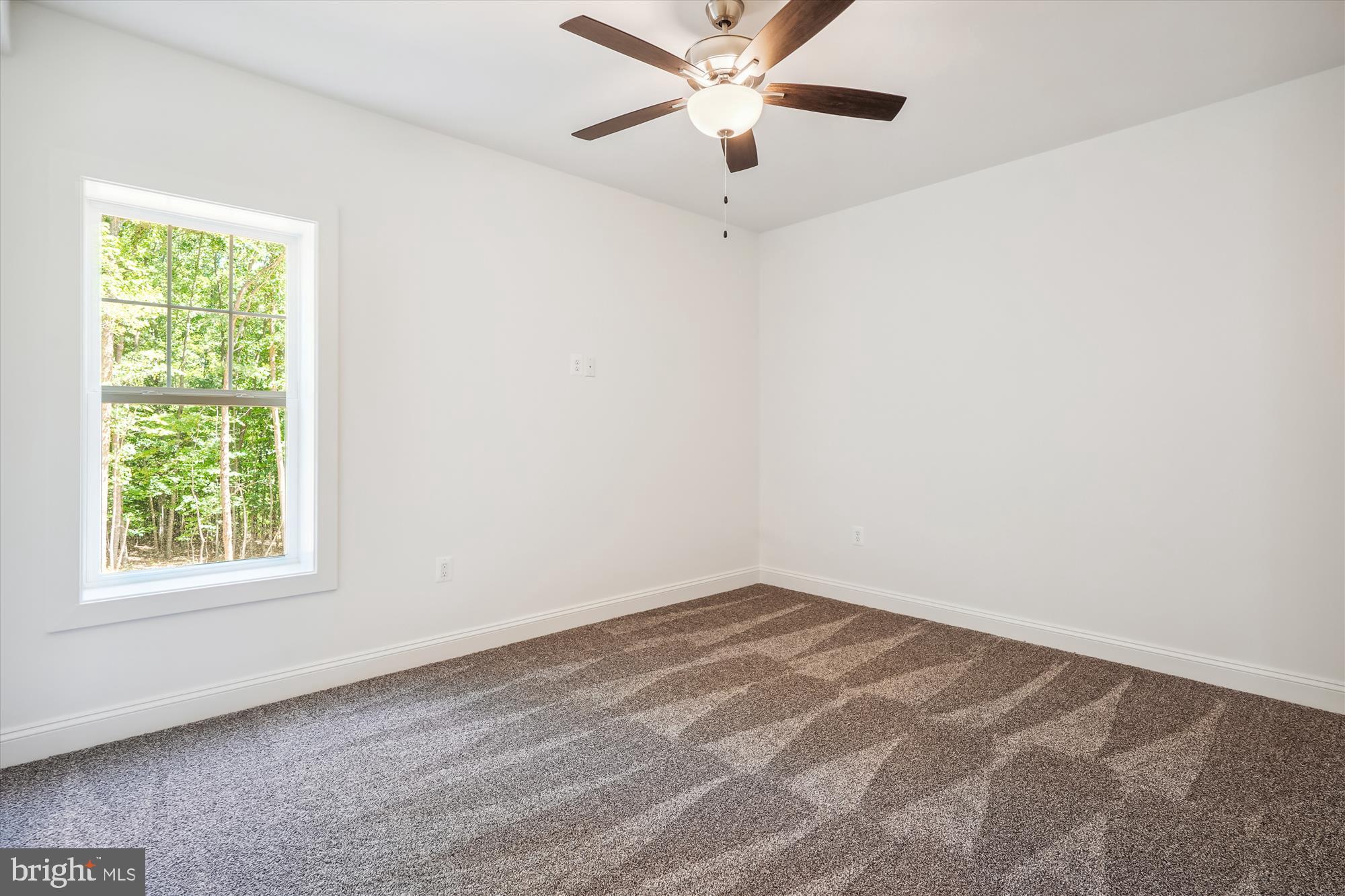 9336 Moses Place Culpeper, VA 22701 - Photo 47 of 50 an empty room with a window and a fan