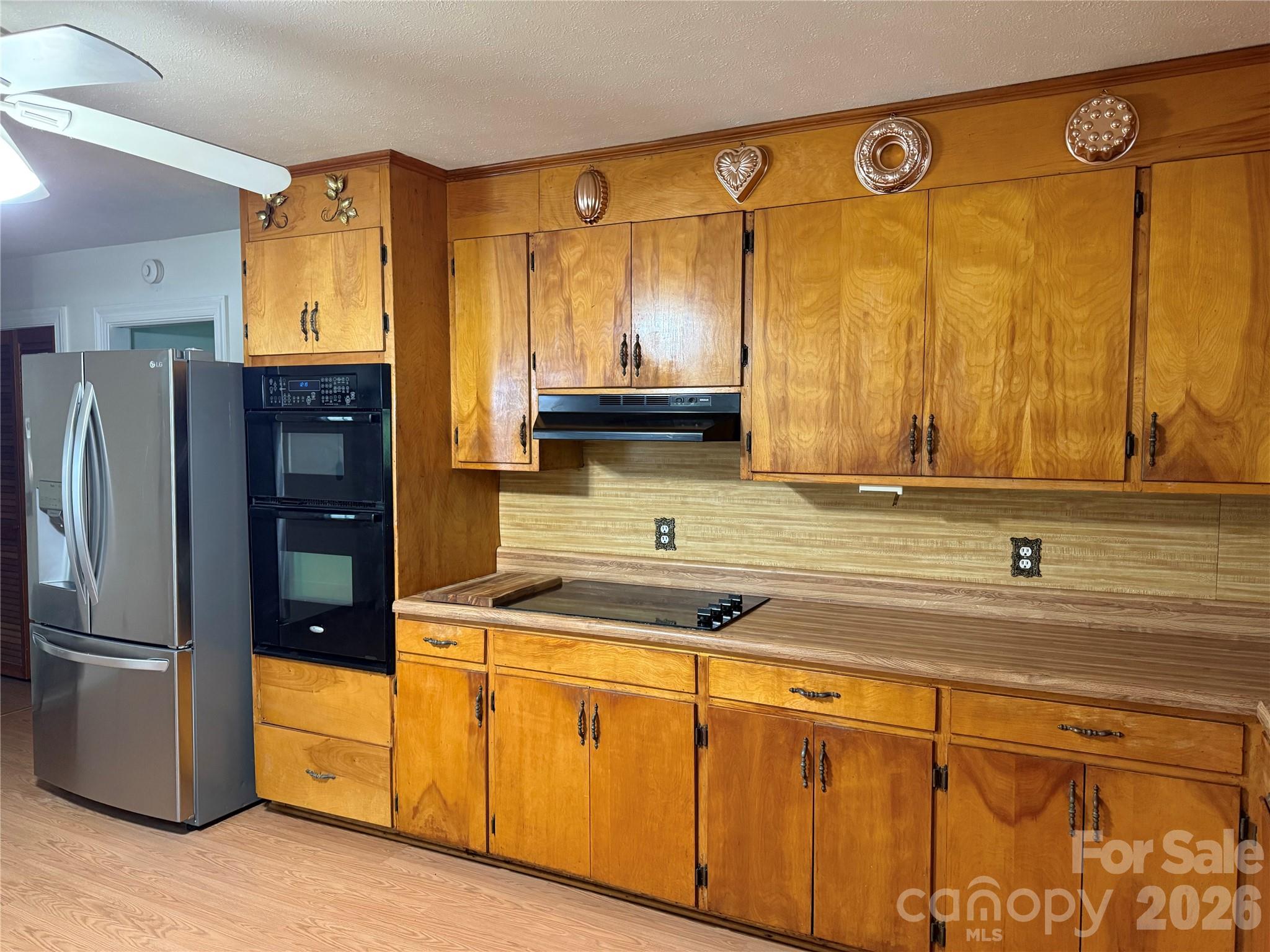 44 Tuttle Road Hendersonville, NC 28792 - Photo 11 of 37 a kitchen with stainless steel appliances granite countertop a refrigerator and a sink