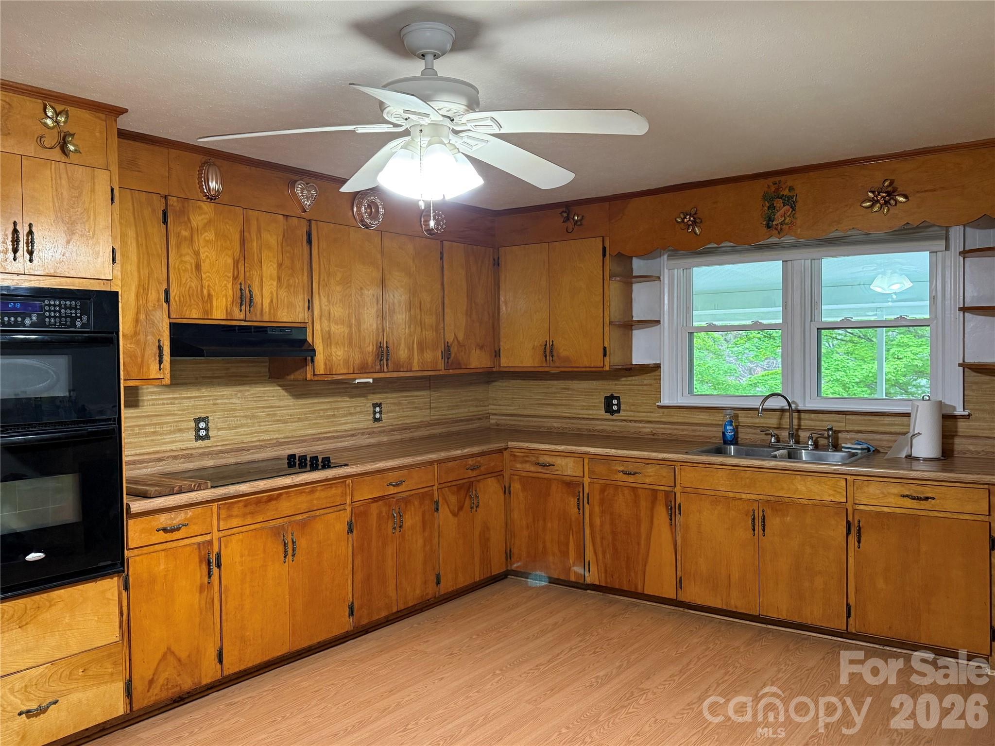 44 Tuttle Road Hendersonville, NC 28792 - Photo 12 of 37 a kitchen with lots of counter space and a sink