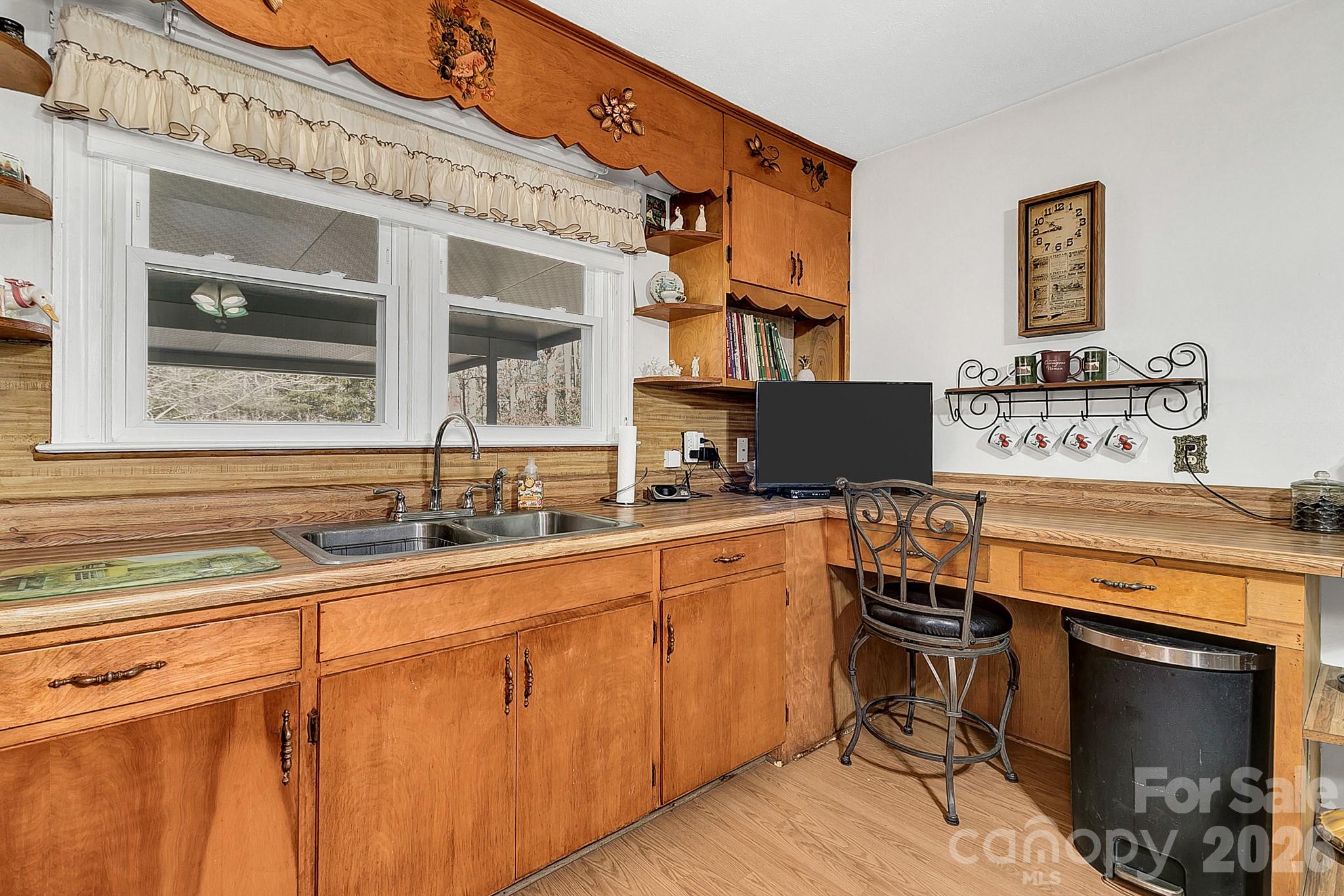 44 Tuttle Road Hendersonville, NC 28792 - Photo 13 of 37 a kitchen with stainless steel appliances granite countertop a stove and a sink