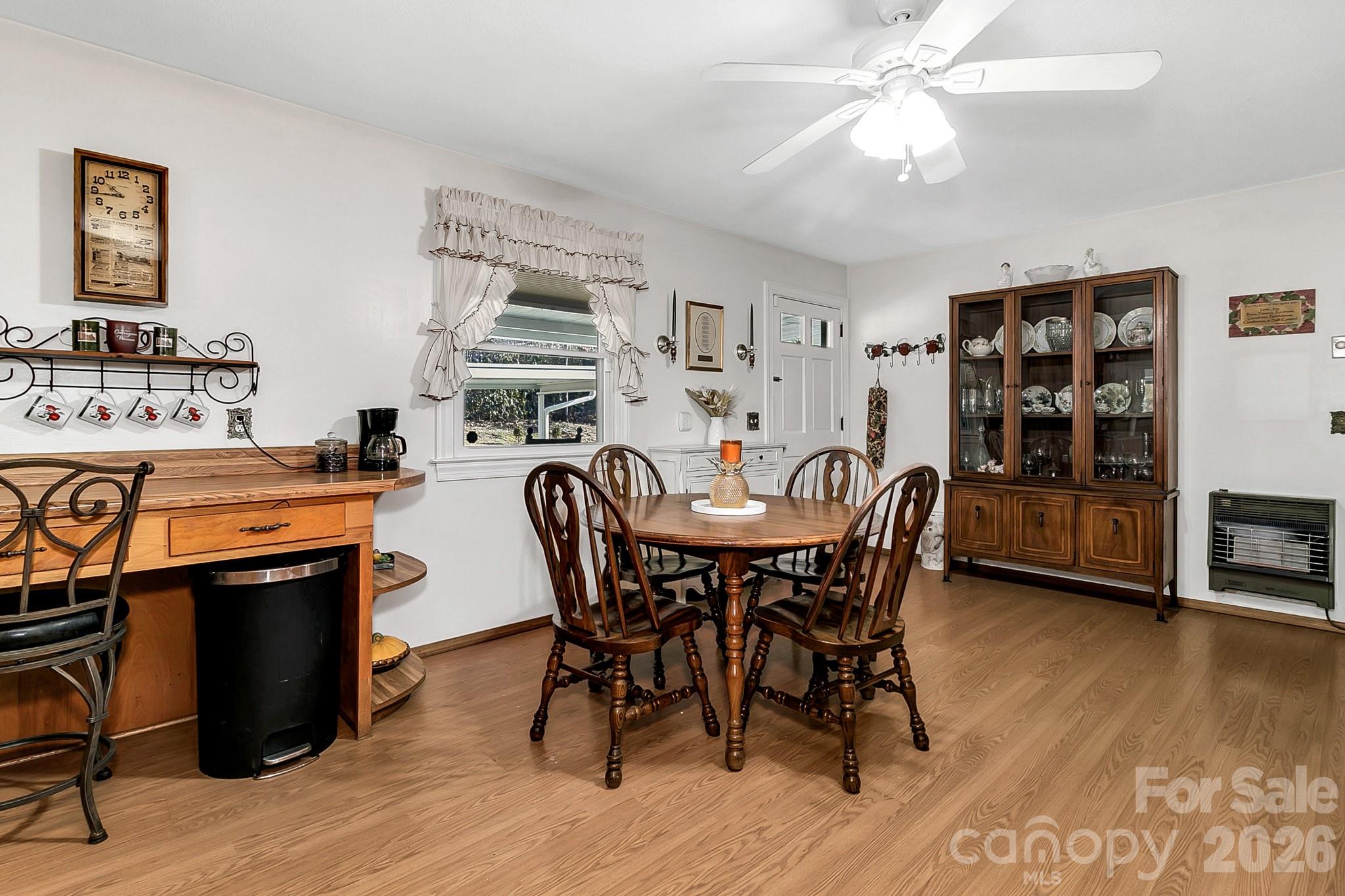 44 Tuttle Road Hendersonville, NC 28792 - Photo 14 of 37 a view of a dining room with furniture and wooden floor