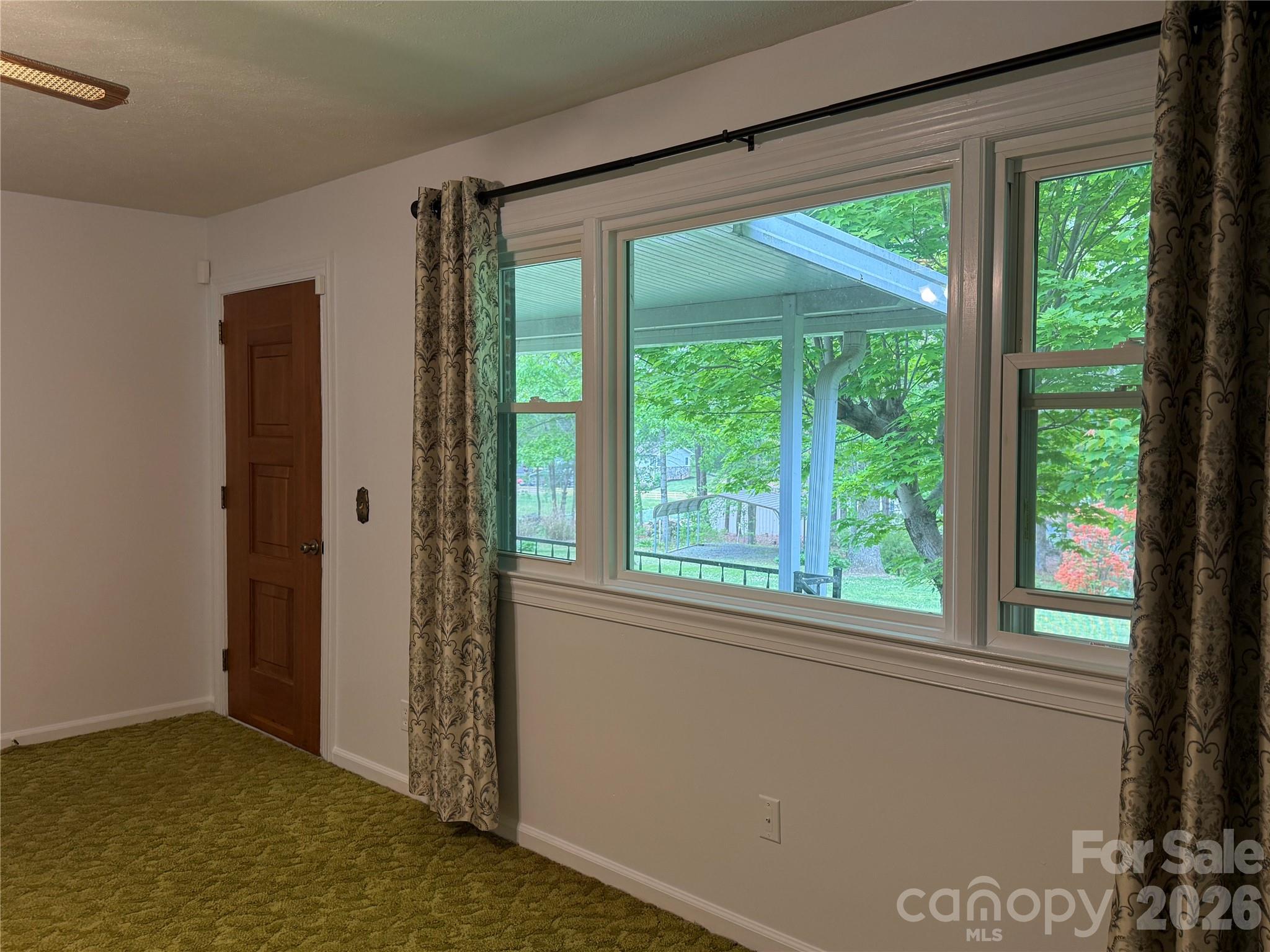 44 Tuttle Road Hendersonville, NC 28792 - Photo 17 of 37 a view of an empty room with a window