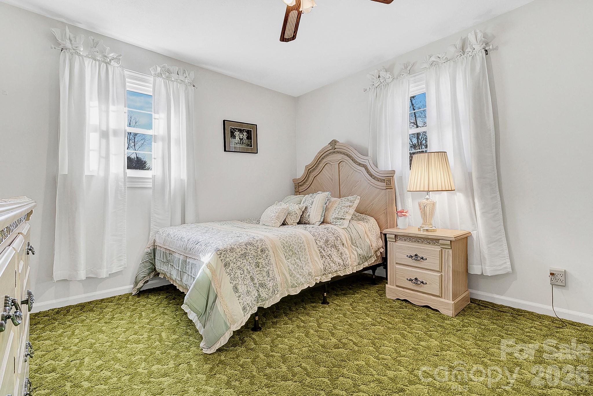 44 Tuttle Road Hendersonville, NC 28792 - Photo 20 of 37 a bedroom with a bed and a window