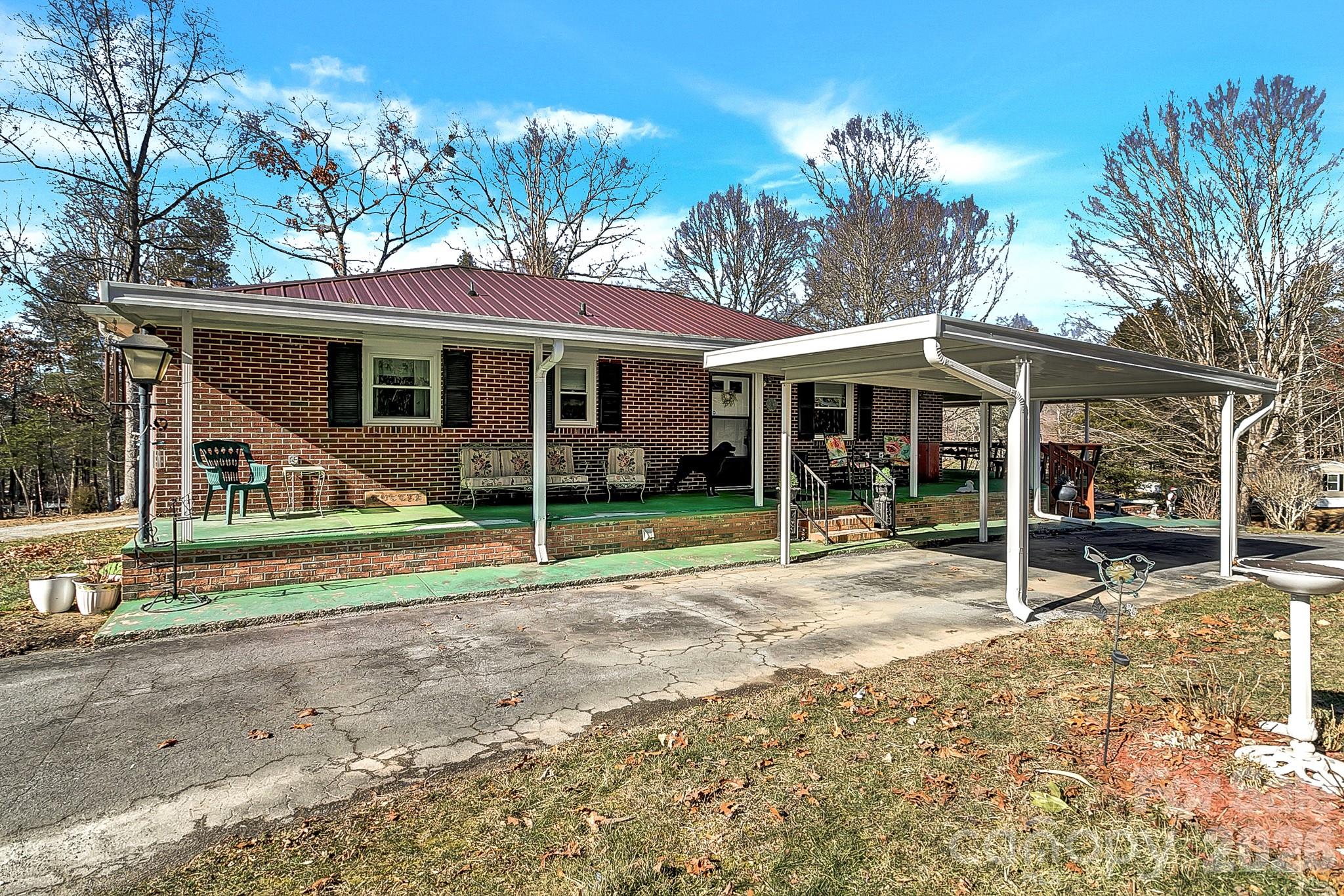 44 Tuttle Road Hendersonville, NC 28792 - Photo 2 of 37 a view of a house with a yard and sitting area