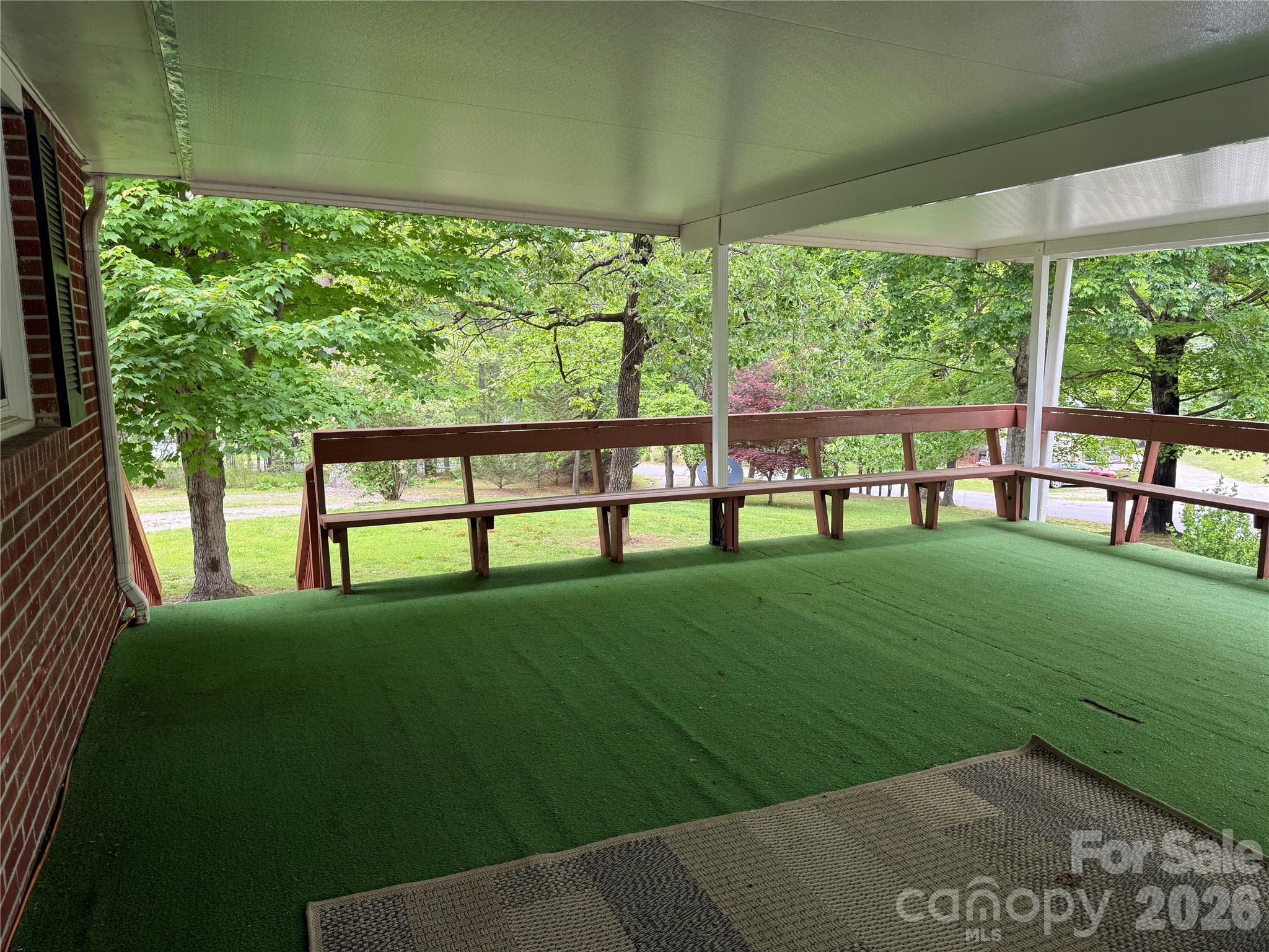 44 Tuttle Road Hendersonville, NC 28792 - Photo 8 of 37 a view of backyard with a garden and plants