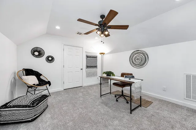 a work room with furniture and windows