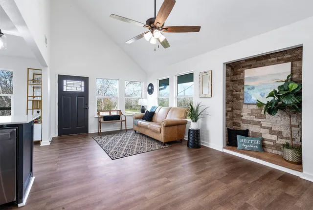 a living room with furniture and a fireplace