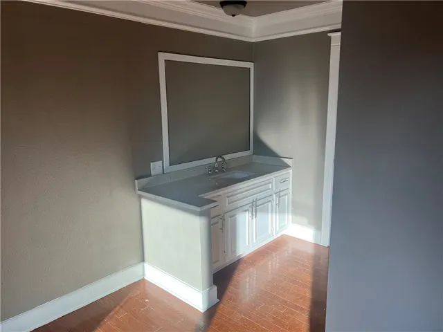 a view of cabinets and wooden floor