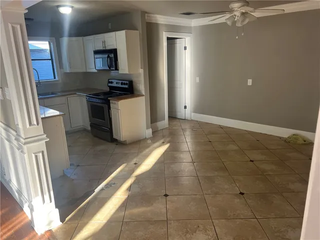 a view of a kitchen with a sink