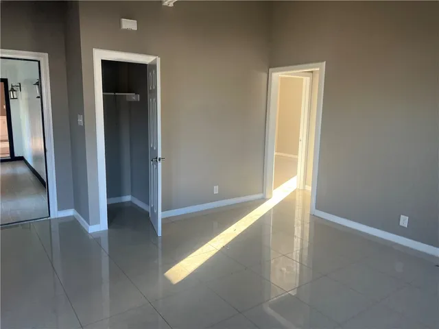 a view of an empty room and window