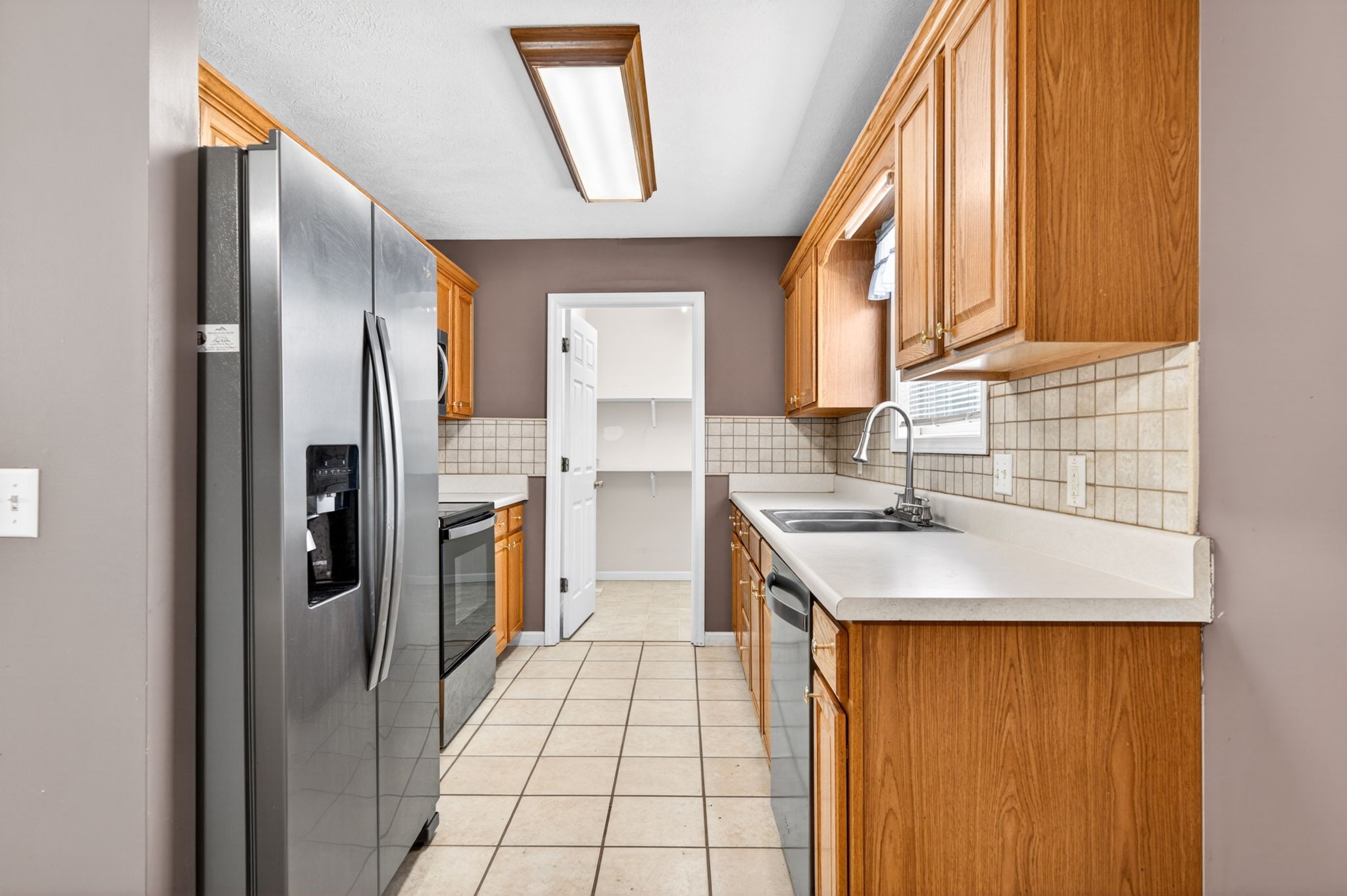 291 Poplar Point Lane Rickman, TN 38580 - Photo 5 of 41 a kitchen with a sink a refrigerator and cabinets