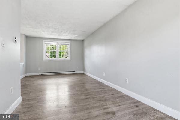 3496 Fox Ridge Court Dover, PA 17315 - Photo 13 of 35 an empty room with wooden floor and windows