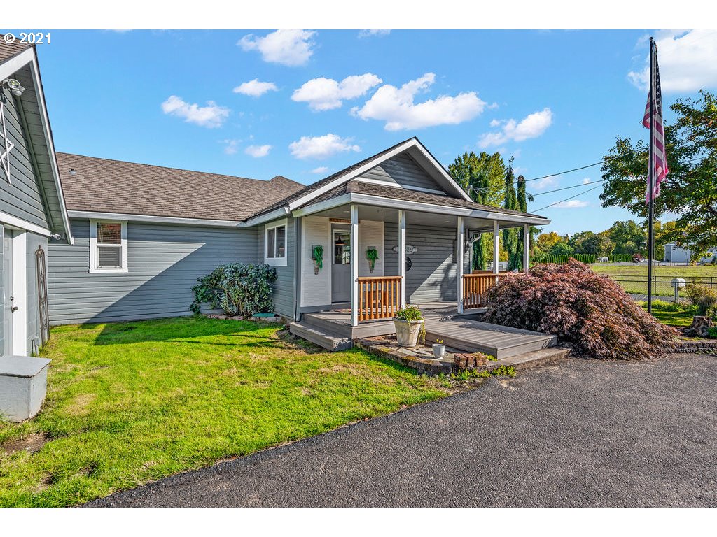 320 Northwest 194th Street Ridgefield, WA 98642 - Photo 2 of 32 a view of a house with backyard and sitting area