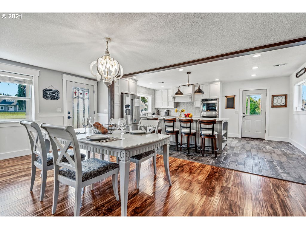 320 Northwest 194th Street Ridgefield, WA 98642 - Photo 14 of 32 a view of a dining room with furniture and chandelier