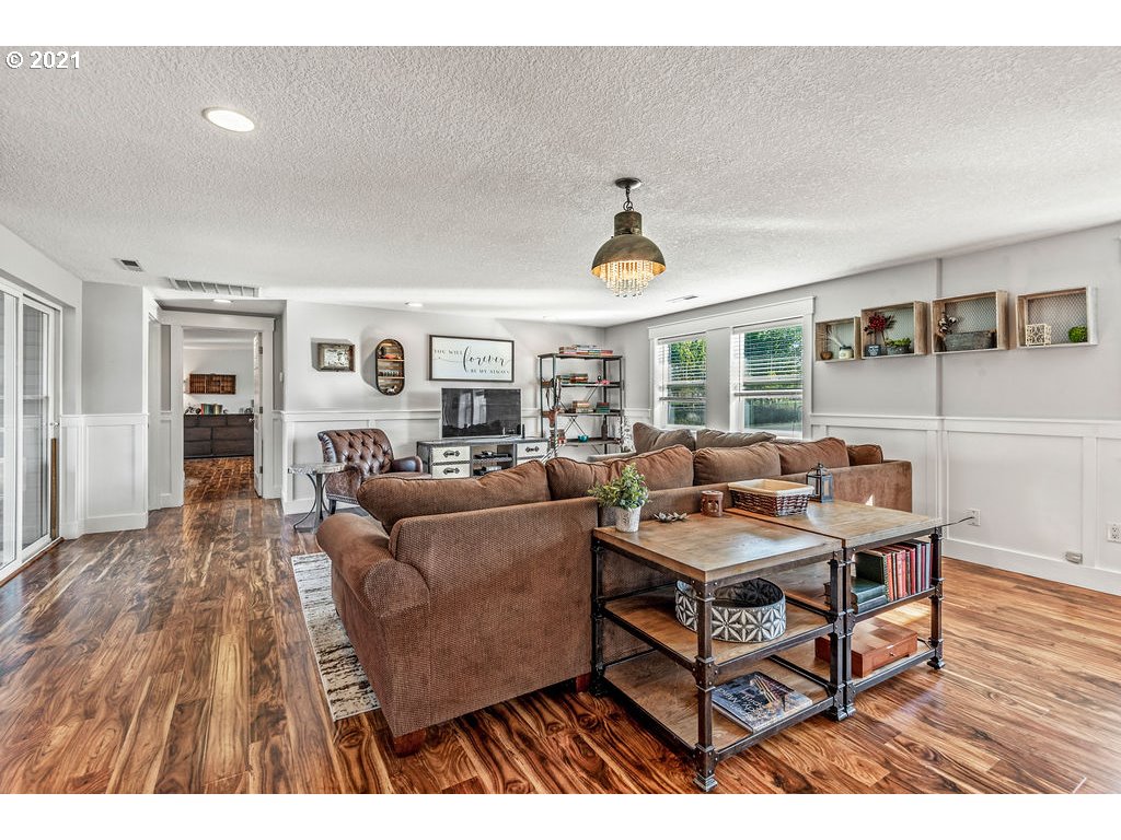 320 Northwest 194th Street Ridgefield, WA 98642 - Photo 18 of 32 a living room with furniture and a wooden floor