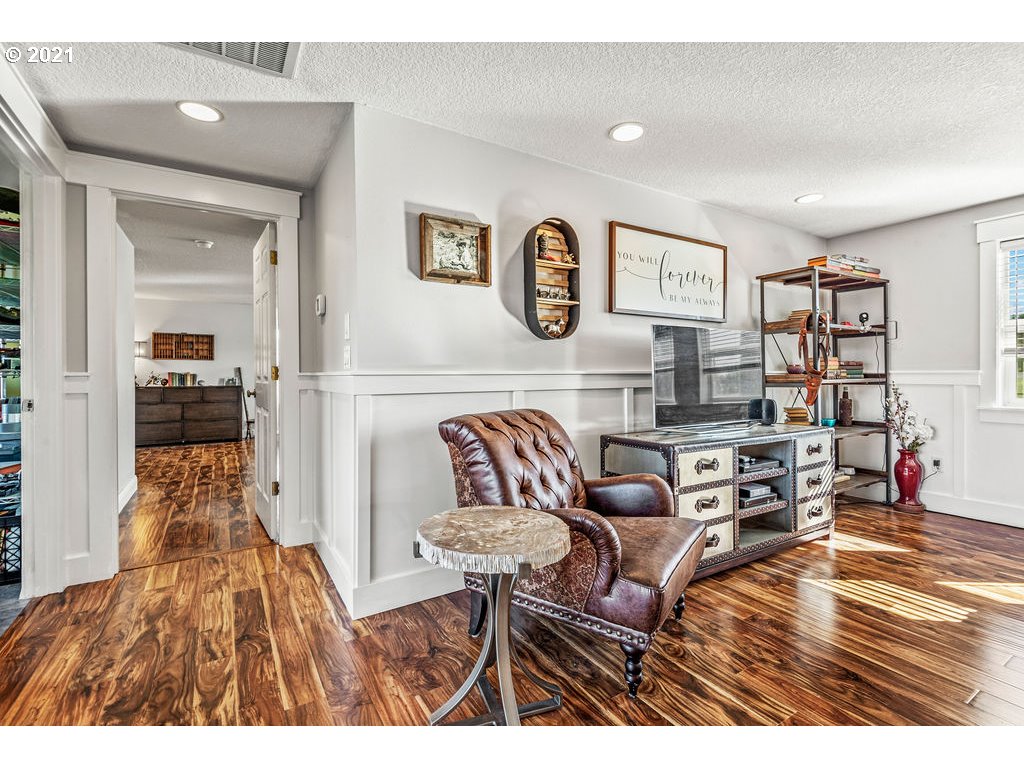 320 Northwest 194th Street Ridgefield, WA 98642 - Photo 19 of 32 a living room with furniture and a wooden floor