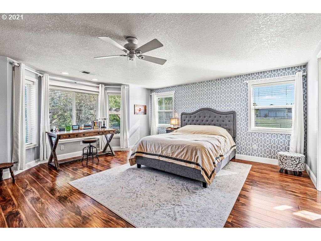 320 Northwest 194th Street Ridgefield, WA 98642 - Photo 20 of 32 a bedroom with a bed and a large window