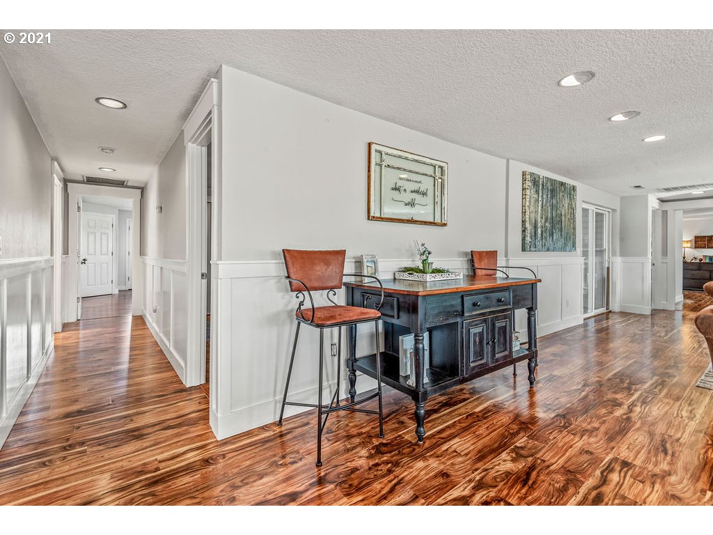 320 Northwest 194th Street Ridgefield, WA 98642 - Photo 24 of 32 a living room with furniture and a wooden floor