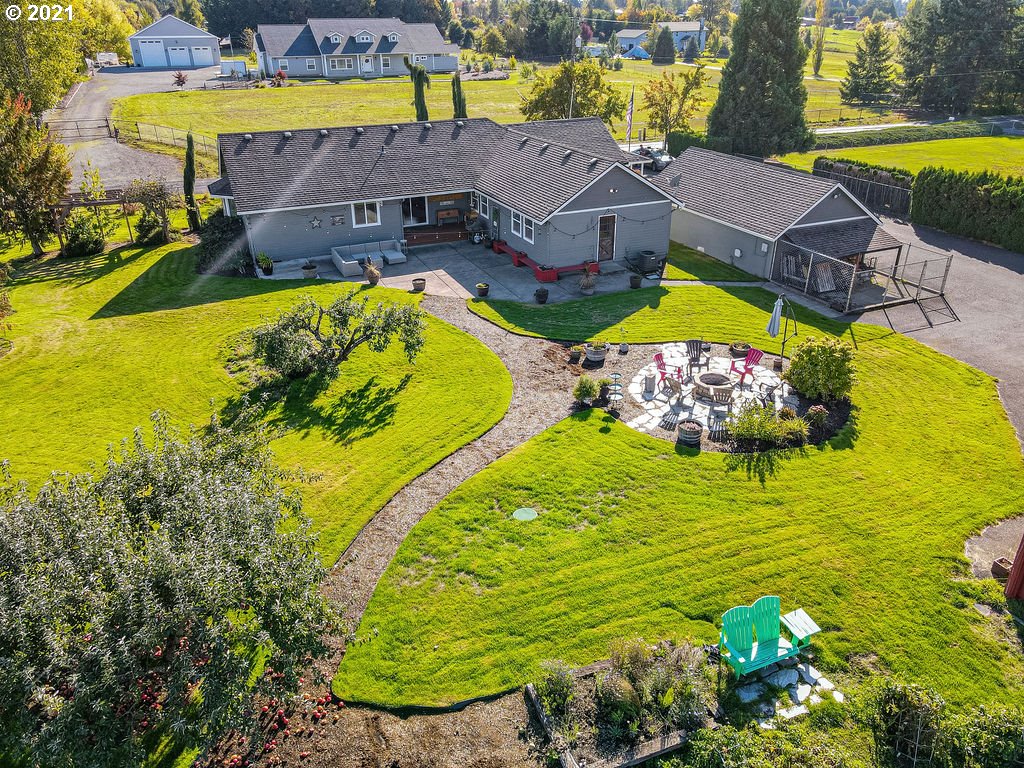 320 Northwest 194th Street Ridgefield, WA 98642 - Photo 4 of 32 a view of a swimming pool with outdoor seating and yard