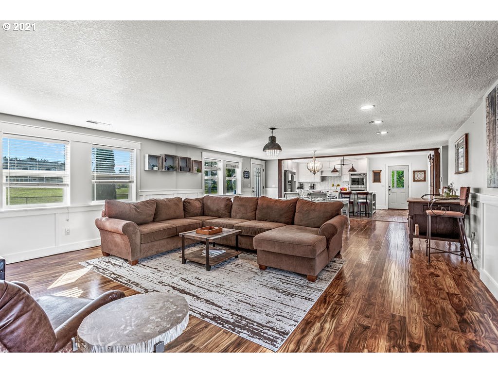 320 Northwest 194th Street Ridgefield, WA 98642 - Photo 10 of 32 a living room with furniture and wooden floor