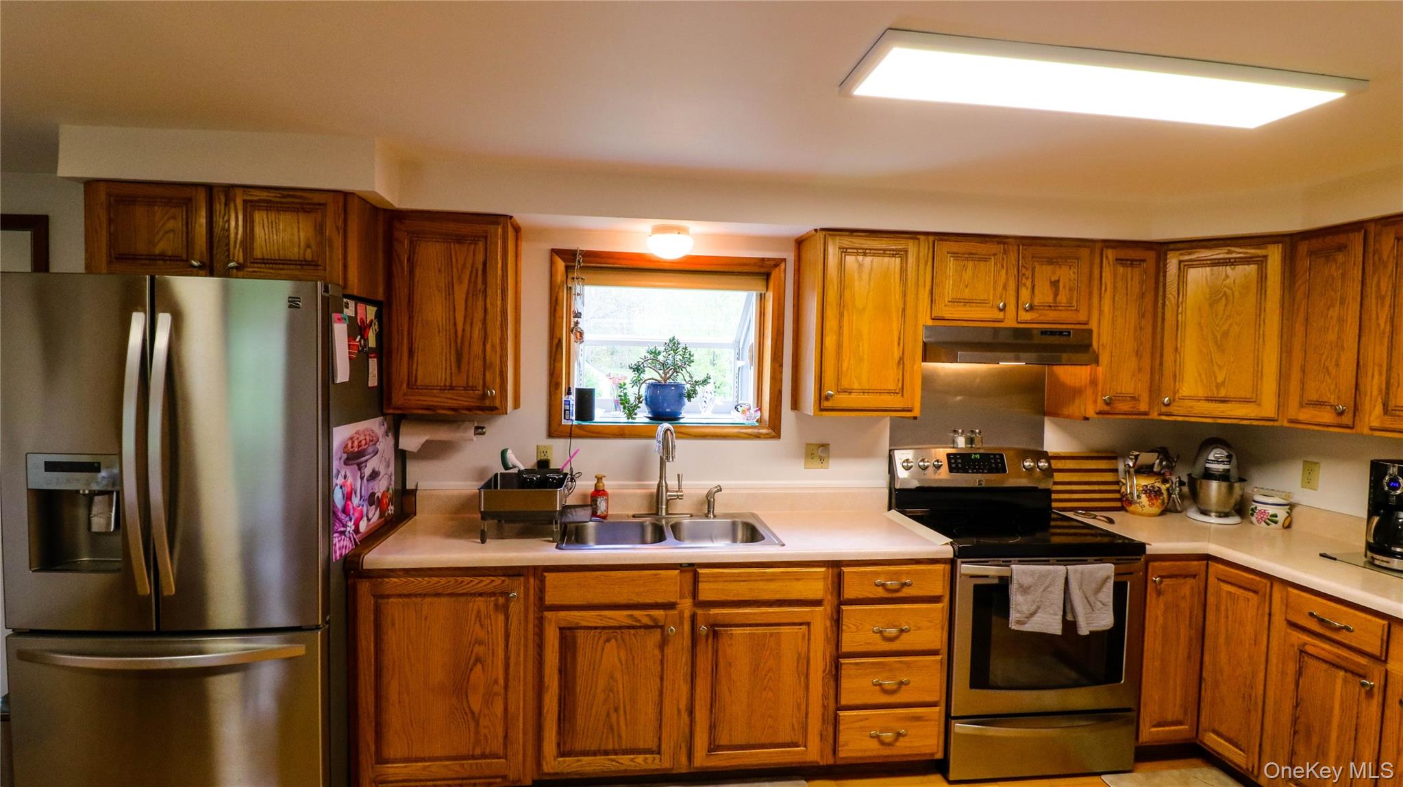 11 Hood Road Roscoe, NY 12776 - Photo 11 of 35 a kitchen with a refrigerator and a sink