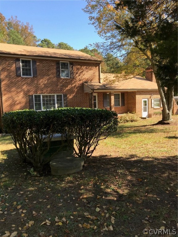8855 Strath Road Henrico, VA 23231 - Photo 1 of 23 a front view of a house with yard