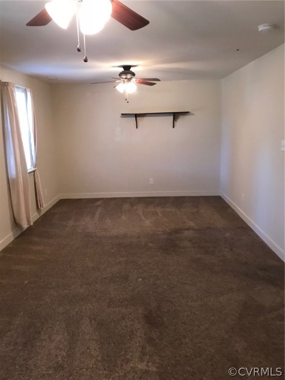 8855 Strath Road Henrico, VA 23231 - Photo 17 of 23 an empty room with a chandelier fan and windows