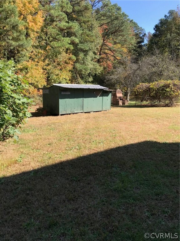 8855 Strath Road Henrico, VA 23231 - Photo 21 of 23 a view of back yard of the house and trees