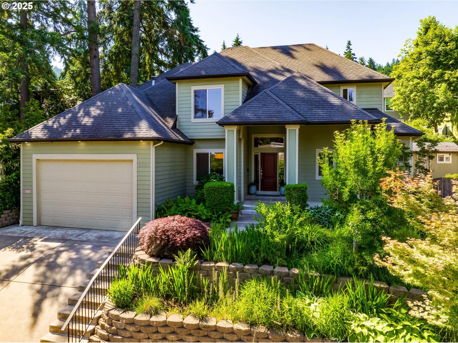 6843 Holly Street Springfield, OR 97478 - Photo 1 of 33 a front view of a house with garden