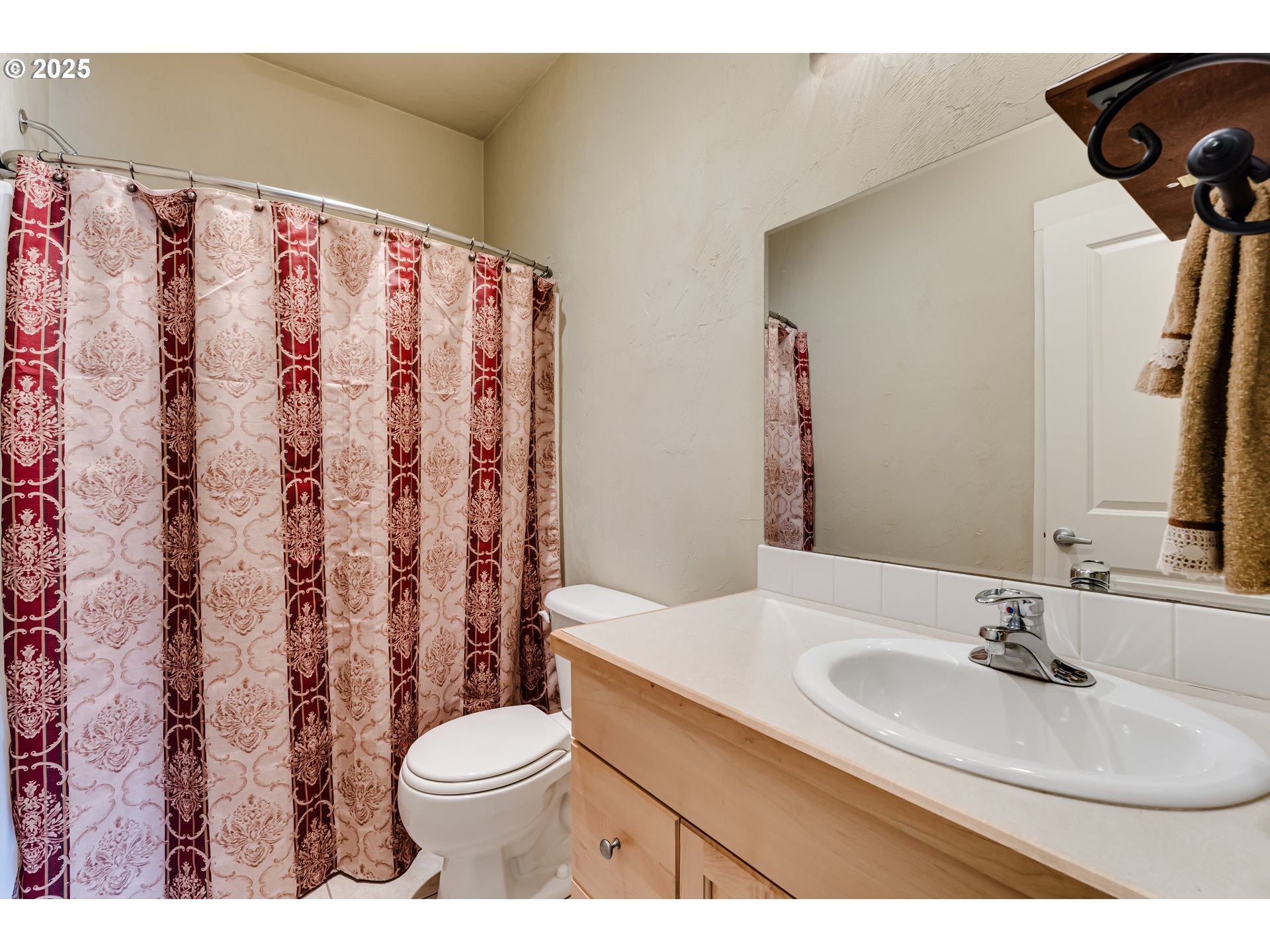 6843 Holly Street Springfield, OR 97478 - Photo 23 of 33 a bathroom with a sink toilet and shower