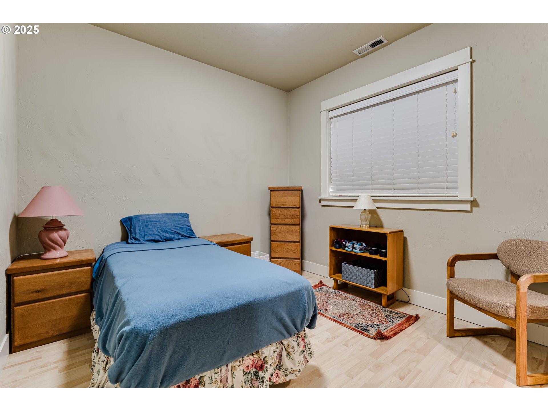 6843 Holly Street Springfield, OR 97478 - Photo 25 of 33 a bedroom with a bed and furniture