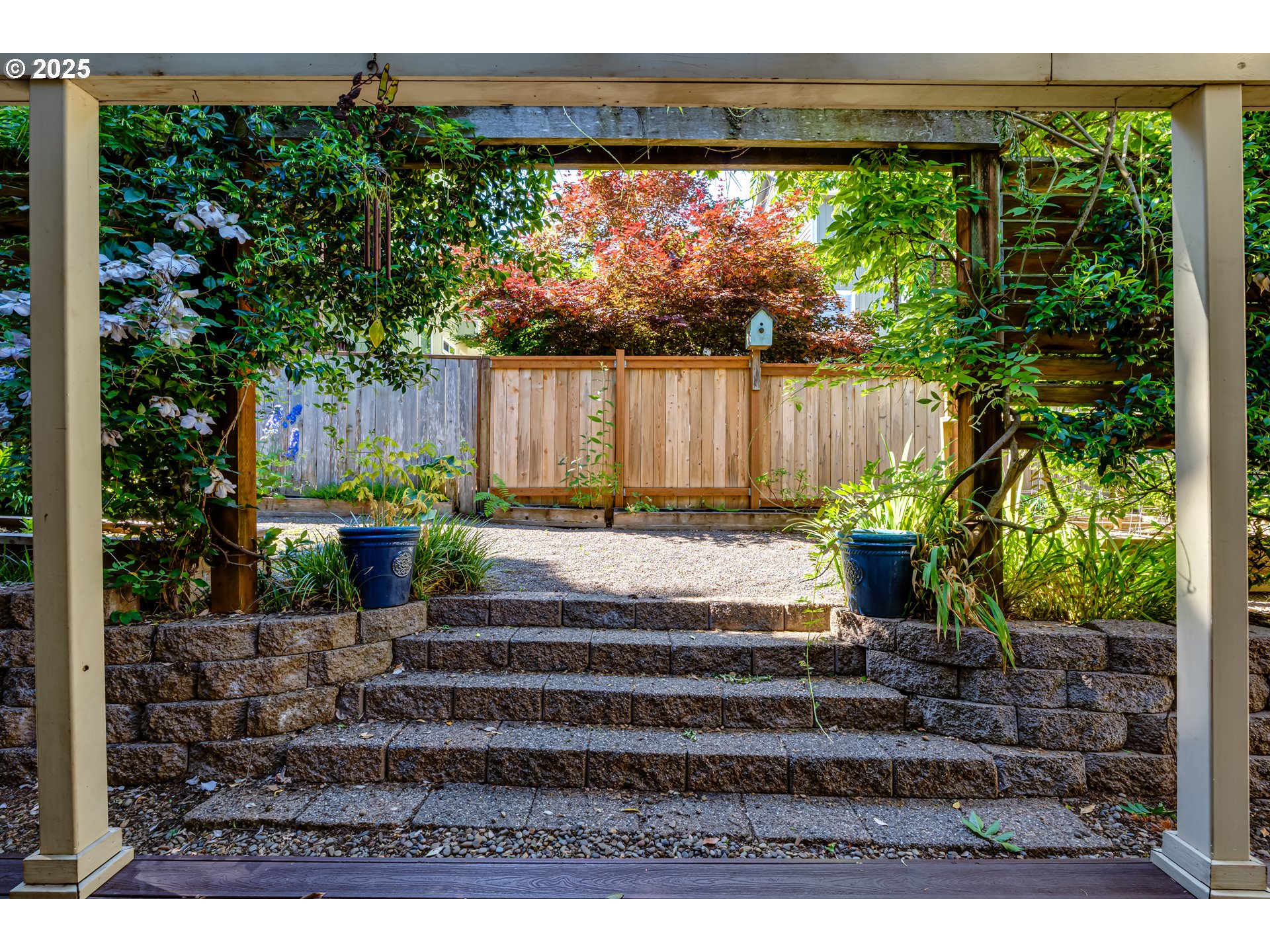 6843 Holly Street Springfield, OR 97478 - Photo 29 of 33 a view of a backyard with a garden
