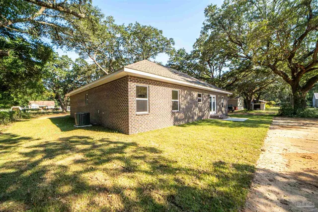 a house view with swimming pool in front of it