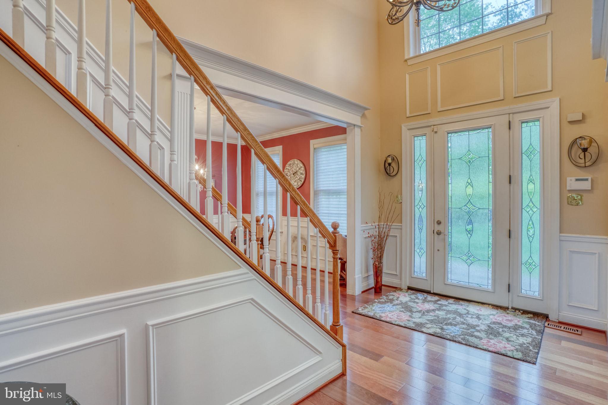 357 Willits Way Garnet Valley, PA 19060 - Photo 4 of 63 a view of an entryway with wooden floor and windows
