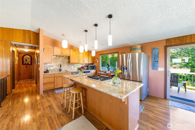 a kitchen with a sink and stove