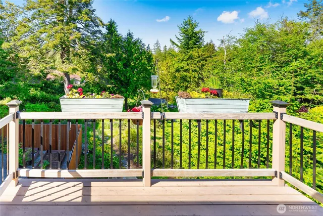 a view of a deck with a white house