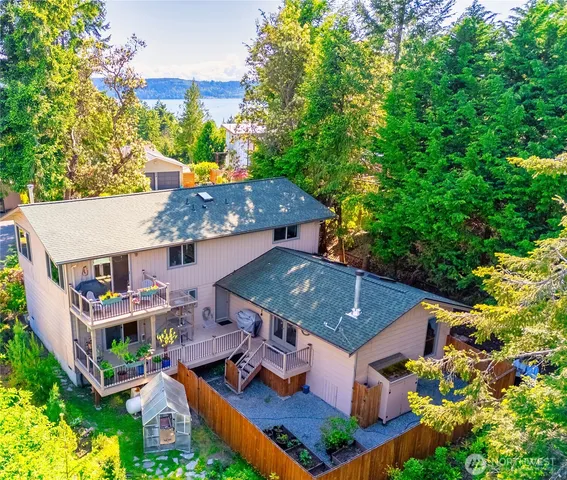 a bathroom with a sink toilet and mirror