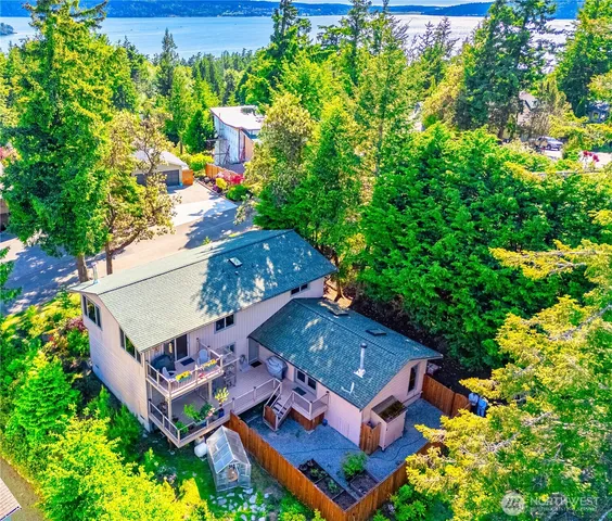 an aerial view of a house with a garden