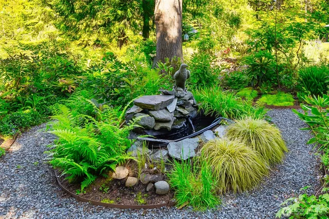 a view of a patio with a table and chairs