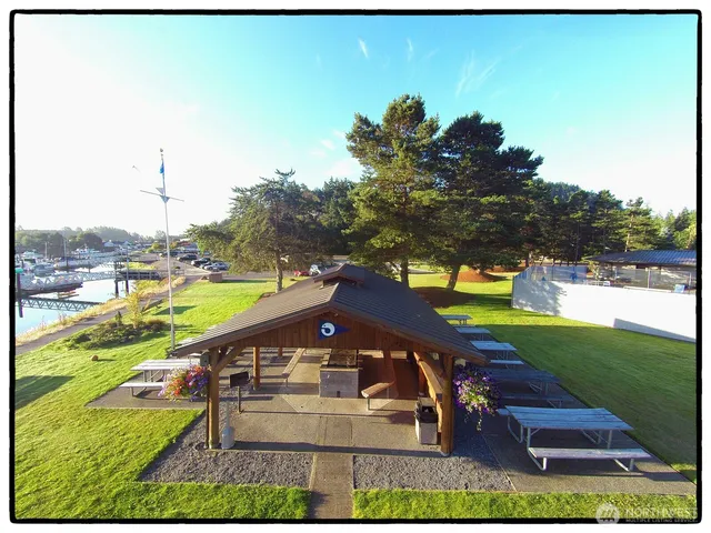 a view of a backyard with a garden and seating area