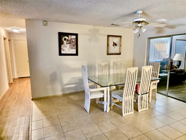 a dining room with furniture and chandelier
