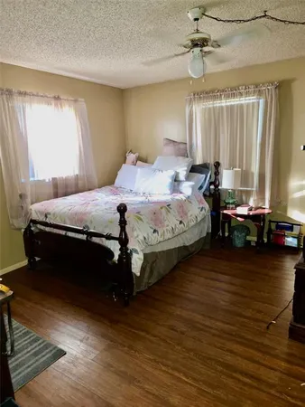 a bedroom with bed and window