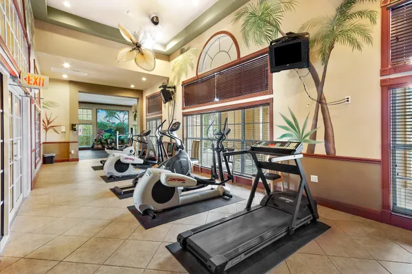 a view of a livingroom with furniture and a floor to ceiling window
