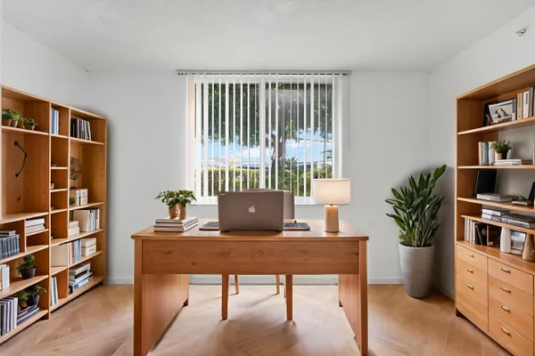 a view of a workspace with furniture