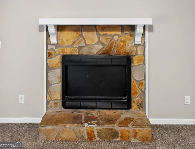 a living room with a fireplace