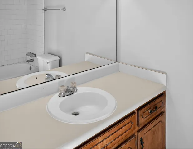 a bathroom with a sink and a bathtub