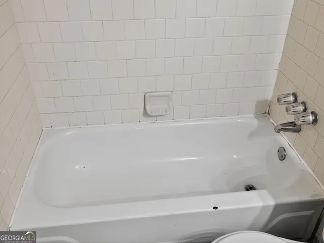a bathroom with a bathtub