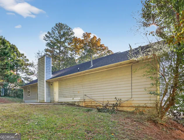 a backyard of a house with lots of green space
