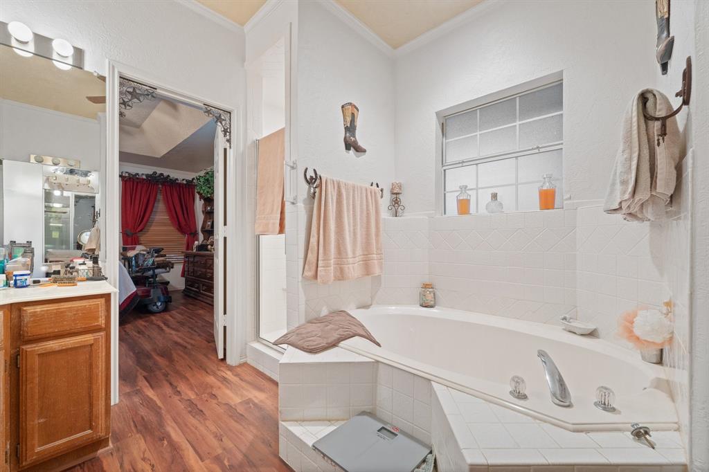 3500 Trails End Road Burleson, TX 76028 - Photo 14 of 24 a bathroom with a tub sink and a mirror